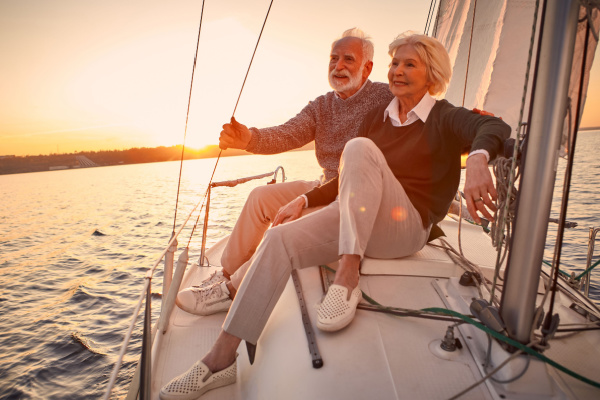 Happy senior couple sailing together and enjoying amazing view. 